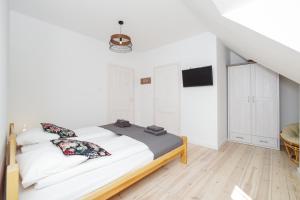 Łóżko lub łóżka w pokoju w obiekcie Sopotel