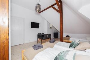 Łóżko lub łóżka w pokoju w obiekcie Sopotel
