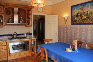 a kitchen with a table with a blue table cloth at Villa Florio in Jūrmala