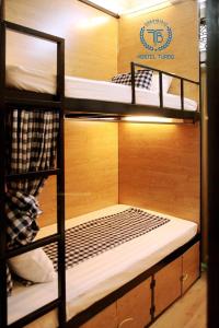 a bunk bed room with three bunk beds in it at HOSTEL TURBO in Hanoi