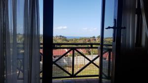 a view of the ocean from a window at Ocean View Villas A08 in Port Edward