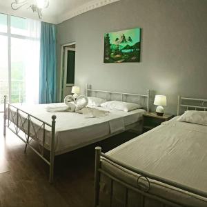 Voodi või voodid majutusasutuse Calypso Kvariati Inn toas
