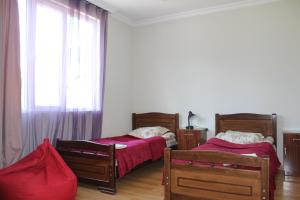 Rúm í herbergi á Mariana's Guest House