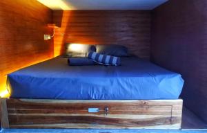 Postel nebo postele na pokoji v ubytování Kaniu Capsule Hostel