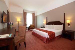 Postel nebo postele na pokoji v ubytování Grand Kampar Hotel