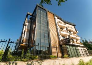 a building with a fence in front of it at BUSINESSPALAS DELUXE in Izmit