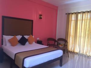 Postel nebo postele na pokoji v ubytování Organic Garden Resort Sigiriya