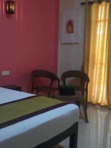 Postel nebo postele na pokoji v ubytování Organic Garden Resort Sigiriya