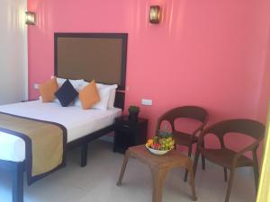 Postel nebo postele na pokoji v ubytování Organic Garden Resort Sigiriya