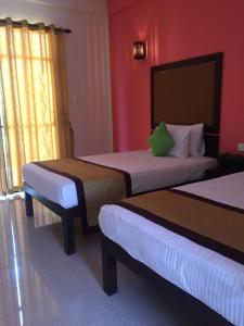 Postel nebo postele na pokoji v ubytování Organic Garden Resort Sigiriya