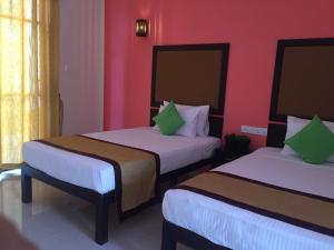 Postel nebo postele na pokoji v ubytování Organic Garden Resort Sigiriya