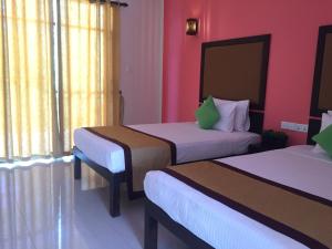 Postel nebo postele na pokoji v ubytování Organic Garden Resort Sigiriya