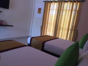 Postel nebo postele na pokoji v ubytování Organic Garden Resort Sigiriya