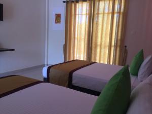 Postel nebo postele na pokoji v ubytování Organic Garden Resort Sigiriya