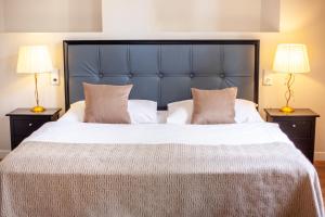 Postel nebo postele na pokoji v ubytování Little King Hotel U Malvaze