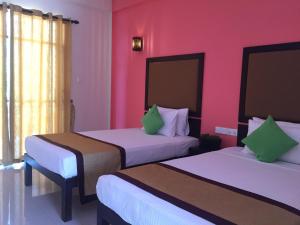 Postel nebo postele na pokoji v ubytování Organic Garden Resort Sigiriya