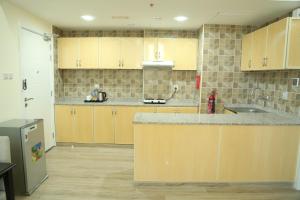 Kuchyň nebo kuchyňský kout v ubytování Uptown Hotel Apartment Fujairah By Gewan