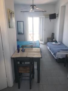 A bed or beds in a room at Studios Panorama Drios