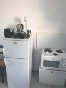 A kitchen or kitchenette at Studios Panorama Drios
