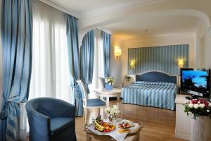 Posteľ alebo postele v izbe v ubytovaní Hotel Italia Palace