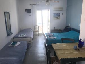 A bed or beds in a room at Studios Panorama Drios