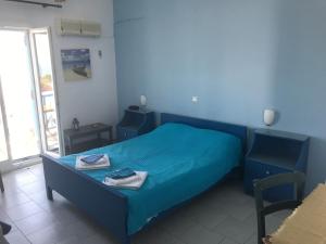 A bed or beds in a room at Studios Panorama Drios