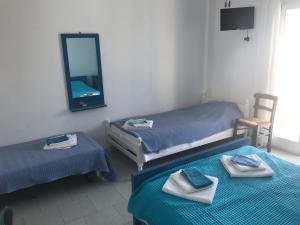 A bed or beds in a room at Studios Panorama Drios