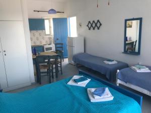 A bed or beds in a room at Studios Panorama Drios Még 37 kép