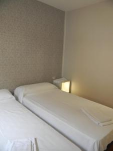 Ein Bett oder Betten in einem Zimmer der Unterkunft Pension Obel