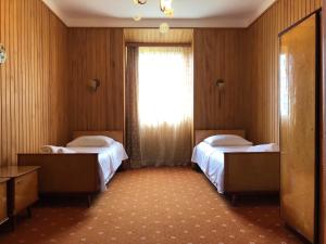 מיטה או מיטות בחדר ב-Green Cape Holiday Home