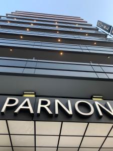 a parron sign on top of a building at Parnon Hotel in Athens