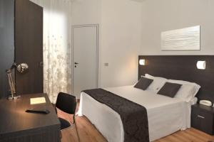 Postel nebo postele na pokoji v ubytování Hotel Niagara