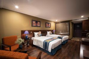Postel nebo postele na pokoji v ubytování Pistachio Hotel Sapa