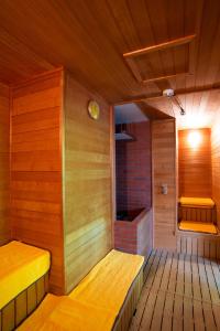 a small room with a wooden floor and wooden walls at One Niseko Resort Towers in Niseko