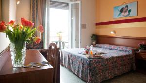 Postel nebo postele na pokoji v ubytování Hotel Dolly