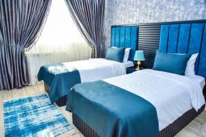 Postel nebo postele na pokoji v ubytování Supreme Hotel Baku