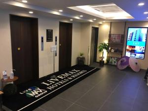 a lobby with a sign on the floor of a room at HOTEL LiVEMAX Kyoto Kamogawamae in Kyoto
