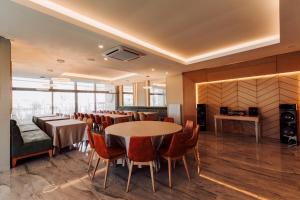 a dining room with tables and chairs in a room at BUSINESSPALAS DELUXE in Izmit