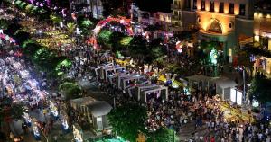 an overhead view of a busy city street at night at Saigon City Center Hostel in Ho Chi Minh City