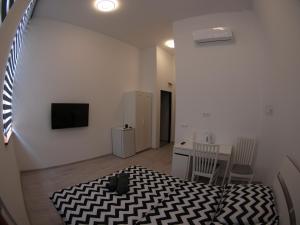 Telewizja i/lub zestaw kina domowego w obiekcie Bulwary Apartments