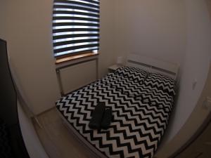 Łóżko lub łóżka w pokoju w obiekcie Bulwary Apartments