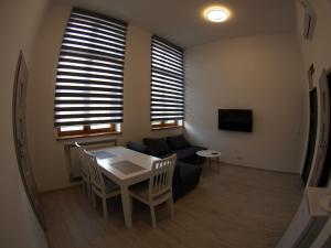 Telewizja i/lub zestaw kina domowego w obiekcie Bulwary Apartments