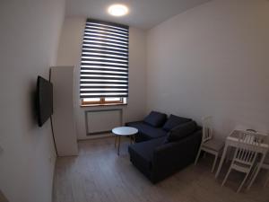 Telewizja i/lub zestaw kina domowego w obiekcie Bulwary Apartments