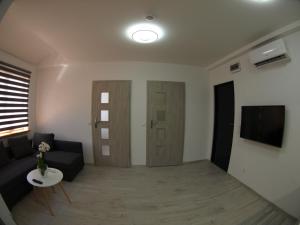 Telewizja i/lub zestaw kina domowego w obiekcie Bulwary Apartments
