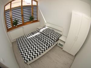 Łóżko lub łóżka w pokoju w obiekcie Bulwary Apartments