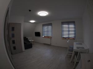 Telewizja i/lub zestaw kina domowego w obiekcie Bulwary Apartments