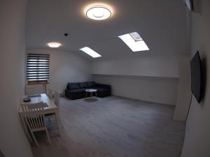 Telewizja i/lub zestaw kina domowego w obiekcie Bulwary Apartments