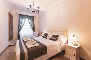 Un pat sau paturi într-o cameră la Albergo Giardino