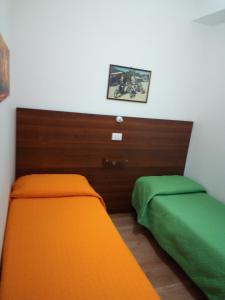 A bed or beds in a room at Casa Ferrara