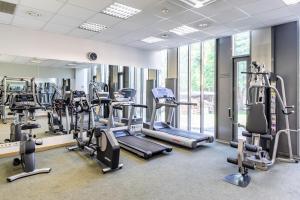 a gym with treadmills and elliptical machines at Rixwell Elefant Hotel in Rīga